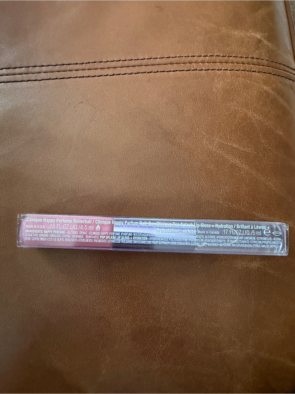 Clinique New Happy Rollerball/Clinique Pop Splash Lip Gloss.